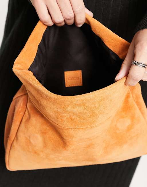 Dark orange clutch on sale bag