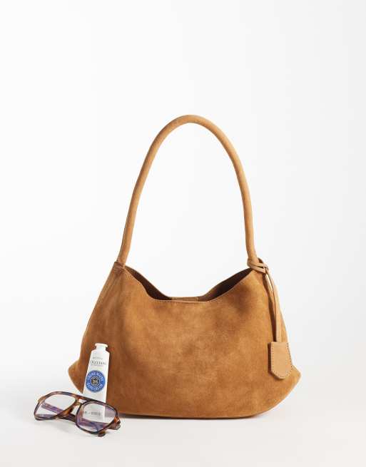 asos suede mini backpack One Arm Back Bag The ASOS DESIGN faux suede wrap mini skirt in brown offers a stylish addition to your wardrobe Backpack Asos Mini Bags Asos