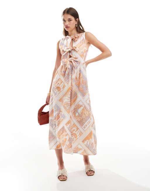 ASOS DESIGN – Sukienka maxi bez rękawów z wiązaniem z przodu w pocztówkowy wzór