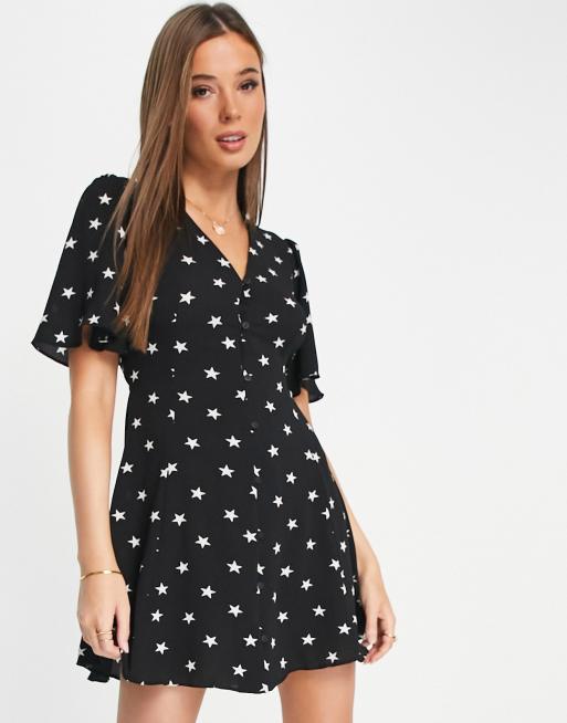ASOS DESIGN – Sukienka mini w gwiazdki z zapięciem na guziki, wiązaniem na plecach i rozkloszowanymi rękawami