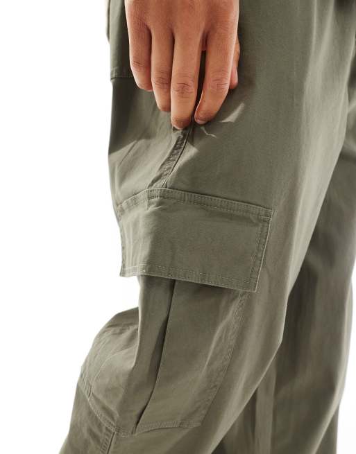 ASOS DESIGN loose cargo pants with elasticized waist in washed green