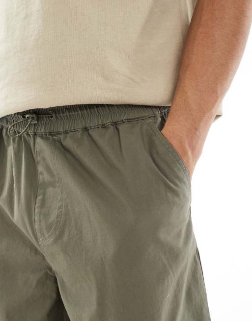 ASOS DESIGN loose cargo pants with elasticized waist in washed green