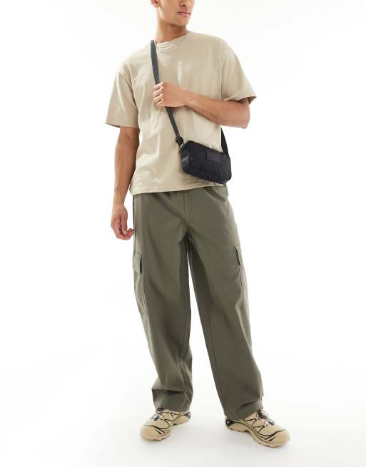 ASOS DESIGN super baggy cargo trousers with elasticated waist in washed green