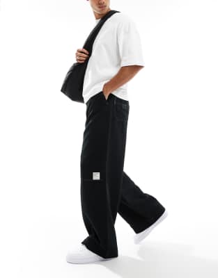 super baggy cord pants in black with contrast stitch