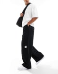 [ASOS DESIGN] ASOS DESIGN super baggy cord pants with contrast stitch in black W30 L32 BLACK