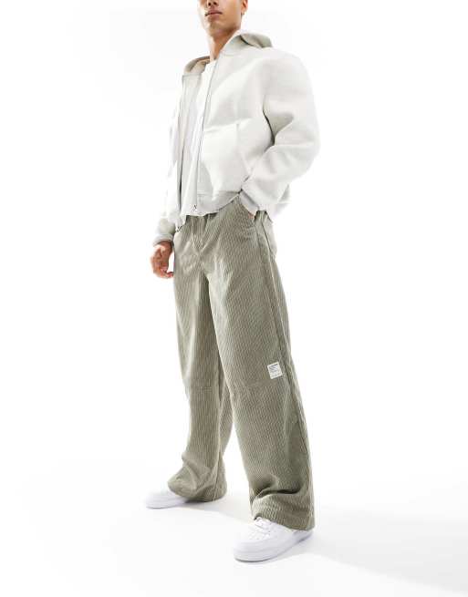 ASOS DESIGN super baggy cord trouser in green with contrast stitch