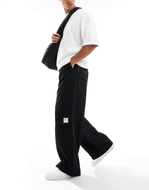 ASOS DESIGN super baggy cord trouser with contrast stitch in black - view 1