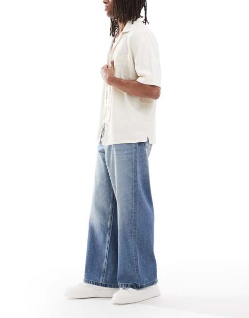 ASOS DESIGN super baggy fit jeans in mid wash blue with tint