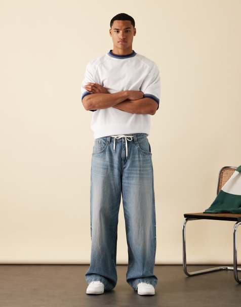 ASOS DESIGN super baggy fit jeans with embroidered back pocket in light wash blue - view 1