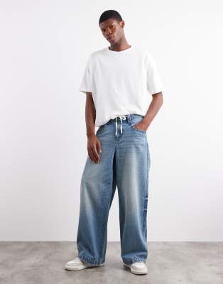 Asos Design Super Baggy Fit Jeans With Embroidered Back Pockets In Blue