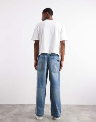 Asos Design Super Baggy Fit Jeans With Embroidered Back Pockets In Blue
