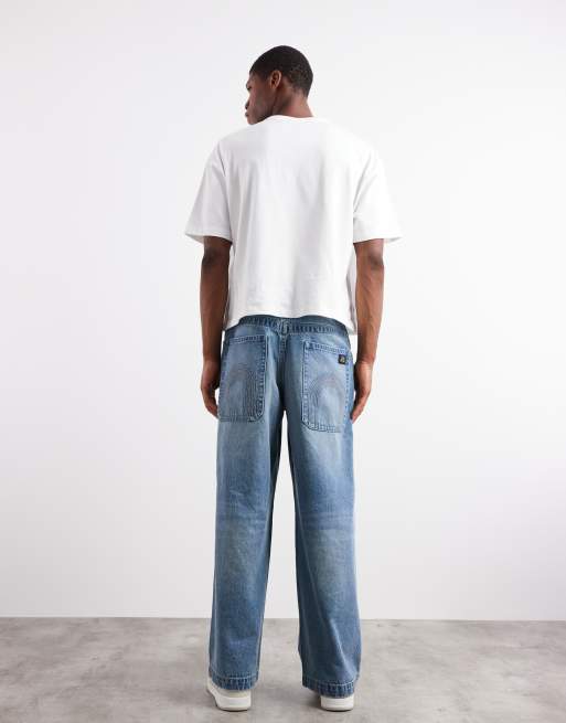 ASOS DESIGN super baggy fit jeans with embroidered back pockets in light wash blue