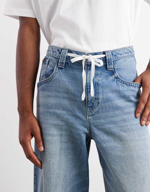 ASOS DESIGN super baggy fit jeans with embroidered back pockets in light wash blue
