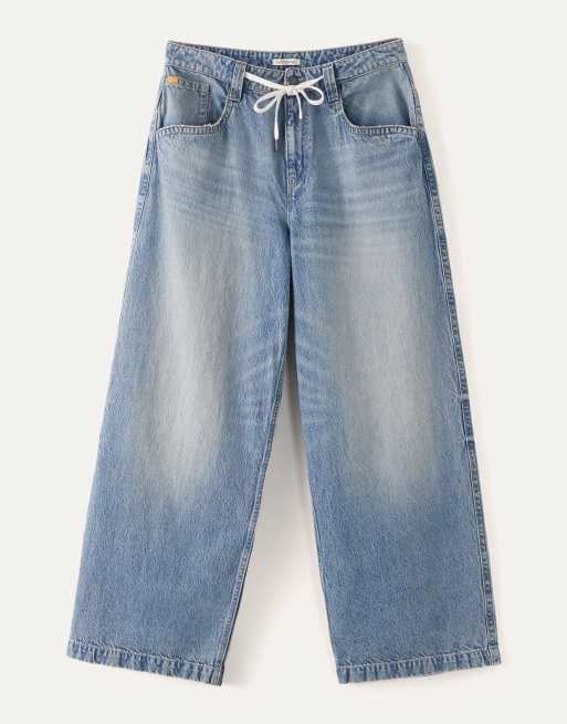 ASOS DESIGN super baggy fit jeans with embroidered back pockets in light wash blue