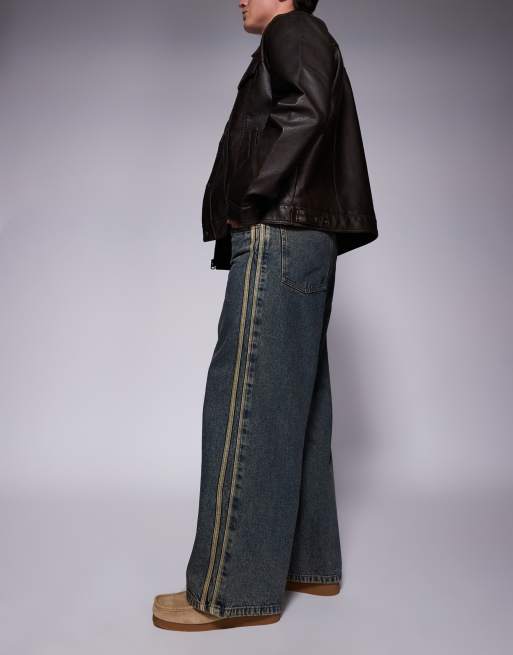 ASOS DESIGN super baggy fit jeans with sporty detail in mid wash blue