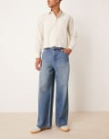 [ASOS DESIGN] ASOS DESIGN super baggy jeans in mid wash blue with embroidered back pocket W28 L32 Mid wash blue