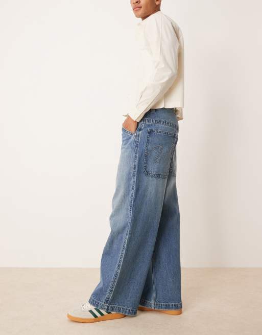 ASOS DESIGN super baggy jeans in mid wash blue with embroidered back pocket