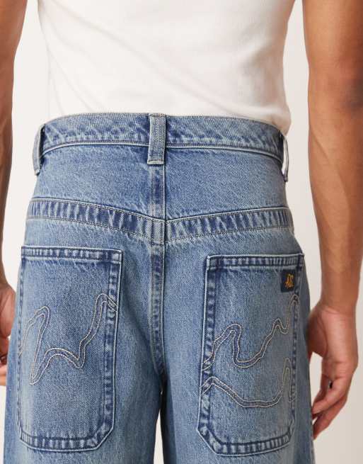 ASOS DESIGN super baggy jeans in mid wash blue with embroidered back pocket