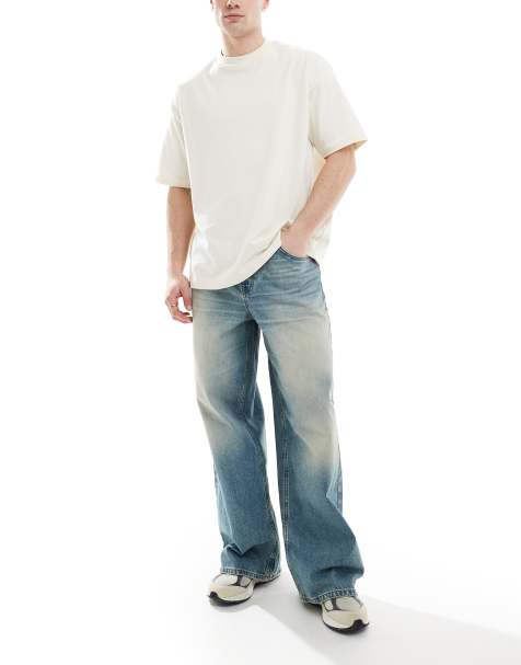 ASOS DESIGN – Super Baggy-Jeans in mittelblauer Waschung mit Farbstich - view 1