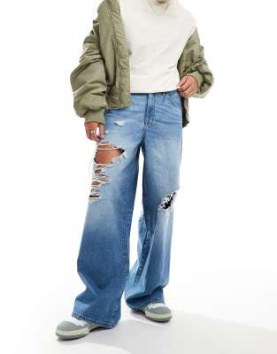 ASOS DESIGN ASOS DESIGN super baggy jeans in washed blue with heavy rips
