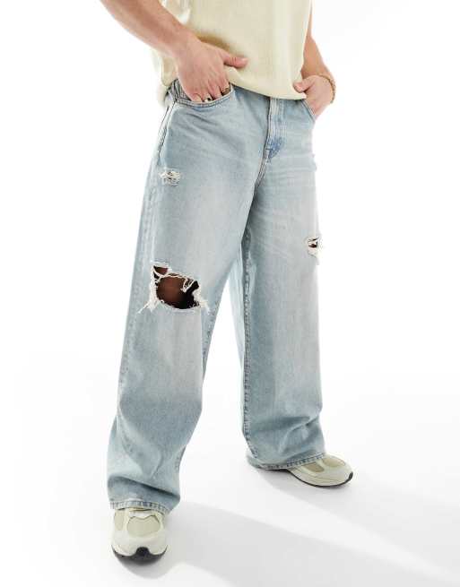ASOS DESIGN - Super baggy jeans met scheuren en slijtageplekken en lichte wassing