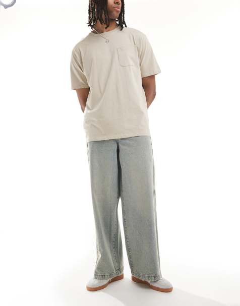 ASOS DESIGN - Super baggy jeans met zijpaneel in lichtblauwe wassing met gele tint - view 1