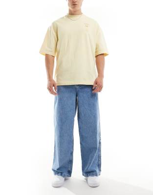 ASOS DESIGN super baggy jeans with ADS logo in mid wash blue
