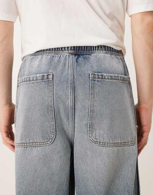 ASOS DESIGN super baggy jeans with elastic waist in mid wash blue, 4 of 5