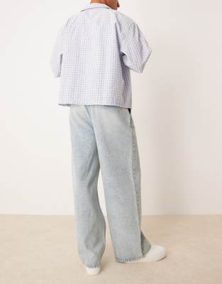 Asos Design Super Baggy Jeans With Front Pleats In Blue