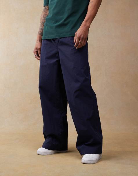 ASOS DESIGN super baggy nylon pull on pants in navy - part of a set - view 1