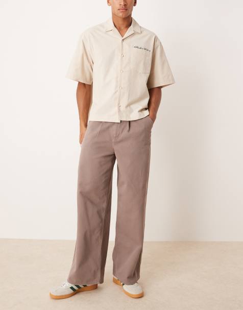 ASOS DESIGN super baggy pleated trouser in brown - view 1