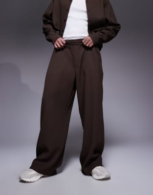 Asos Design Super Baggy Plisse Pants With Elastic Waist In Brown