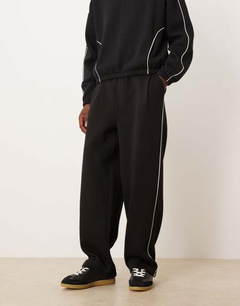 ASOS DESIGN super baggy sweatpants with side piping in black - part of a set - view 1