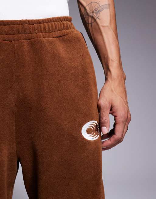 ASOS DESIGN super baggy trackies with panels in brown fleece (part of a set)