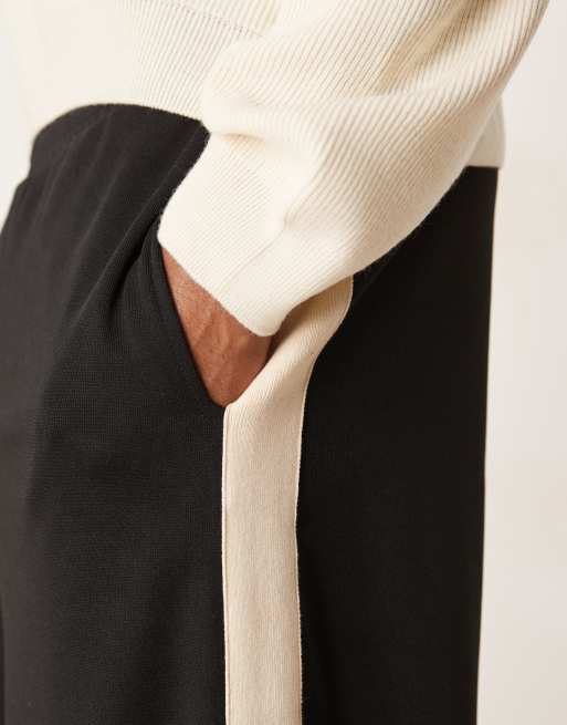 ASOS DESIGN super baggy trackies with taping in black