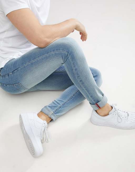 ASOS DESIGN super obcisłe dżinsy jasno sprane