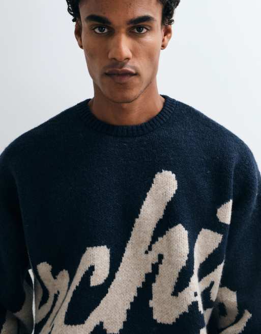 ASOS DESIGN super oversized knitted graphic jumper in navy, 2 of 5