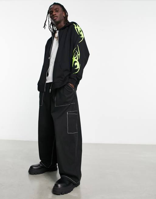 ASOS DESIGN super oversized zip through hoodie in black with neon tattoo sleeve print, 4 of 4