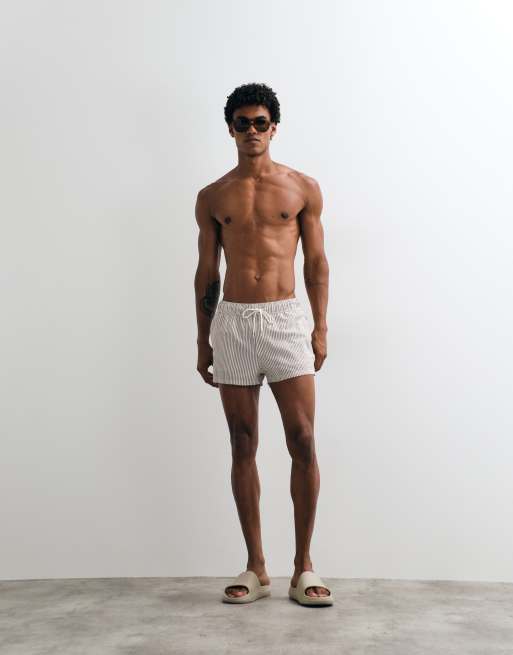 ASOS DESIGN super short length seersucker swim shorts in brown stripes, 2 of 5