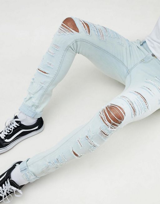 Asos Design Super Skinny Jeans Bleach Wash Blue With Heavy Rips Asos 