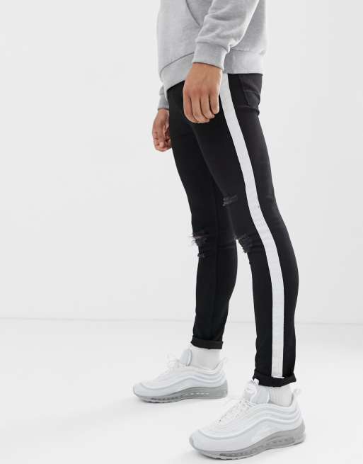 ASOS DESIGN super skinny jeans in black with white sidestripe and knee rips