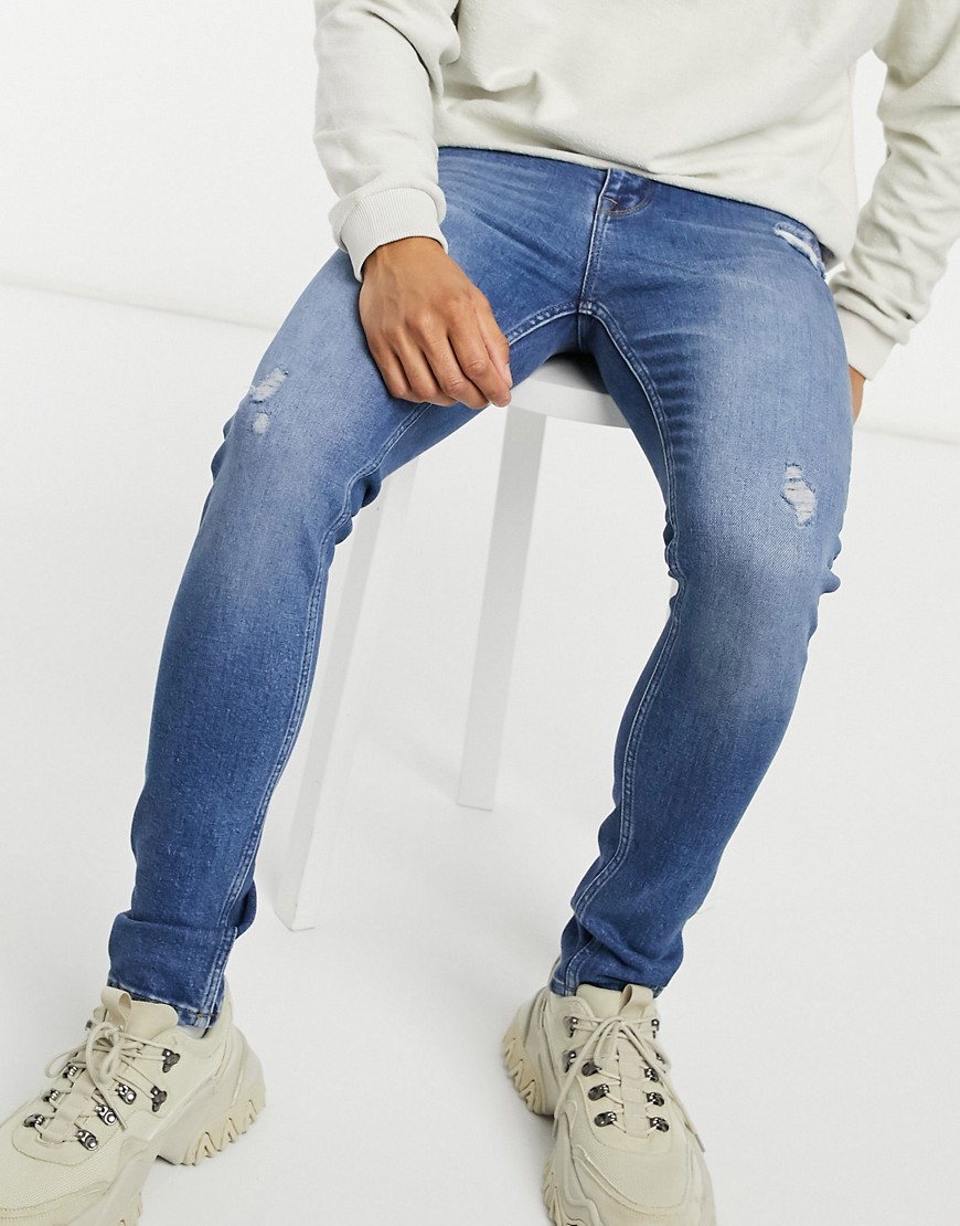 ASOS DESIGN super skinny jeans in dark wash with abrasions-Blue