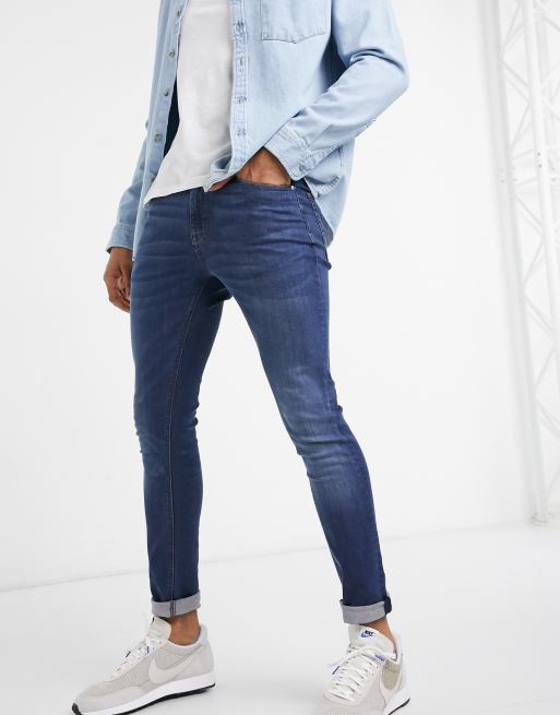 ASOS DESIGN super skinny jeans in mid wash blue with abrasions