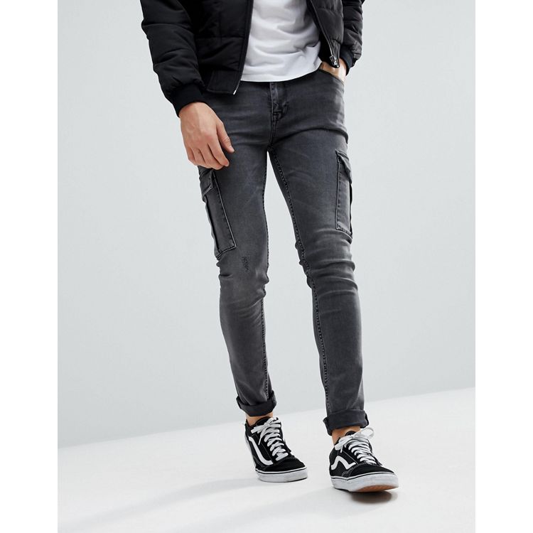 ASOS DESIGN super skinny jeans in washed black with paint splatter