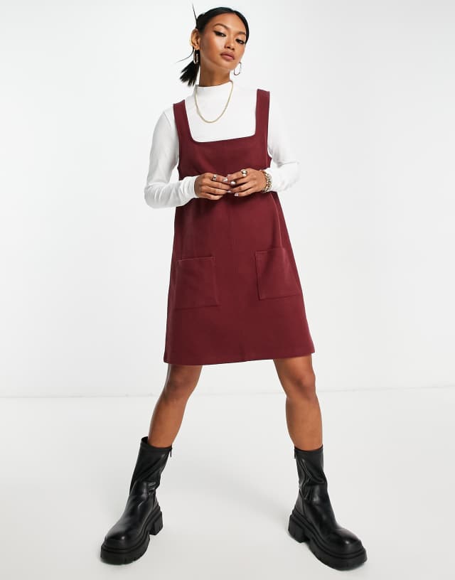 ASOS DESIGN super soft 2 in 1 square neck pinny mini sweater dress in burgundy and white