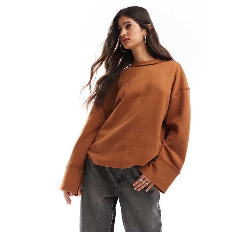 ASOS DESIGN super soft exposed seam sweatshirt with deep cuffs in tan