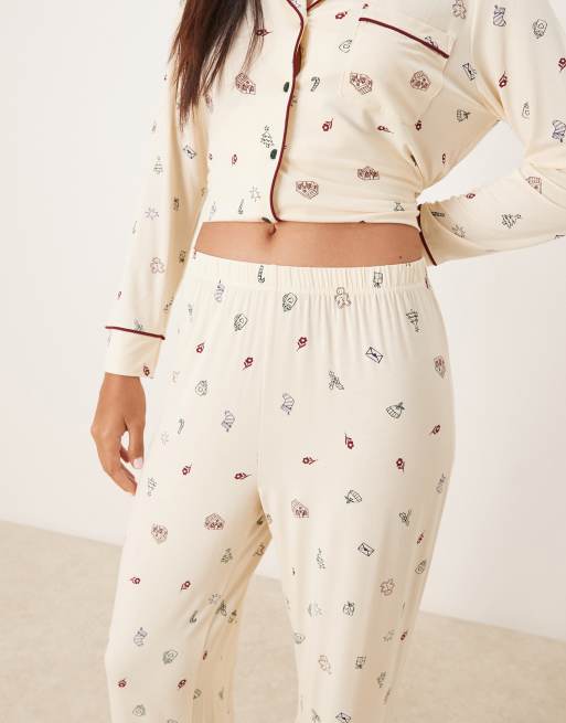 ASOS DESIGN super soft long sleeve shirt & pants pajama set with contrast piping in cream Christmas print