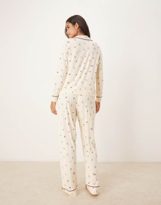 ASOS DESIGN super soft long sleeve shirt & pants pajama set with contrast piping in cream Christmas print