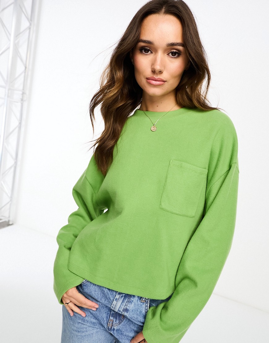 ASOS DESIGN super soft oversized jumper with pocket detail in green