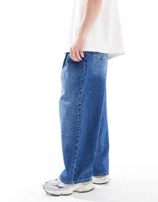 Asos Design Super Wide Leg Jeans With Pleats In Blue